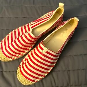 Women’s red and white stripped shoes. New. Never been worn.